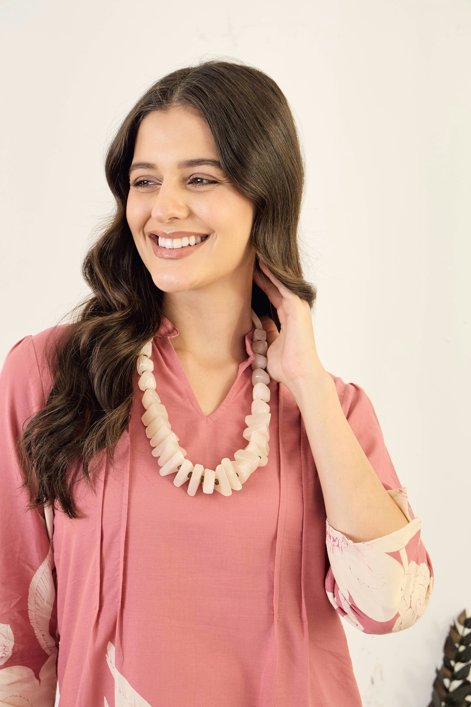 Woman wearing a stone-link necklace